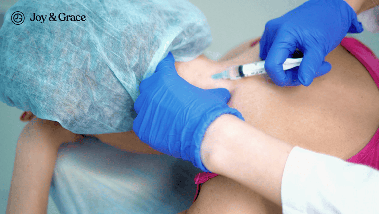 a person getting an injection from the doctor