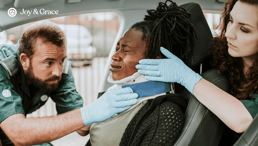 two people putting neck brace on a person's neck