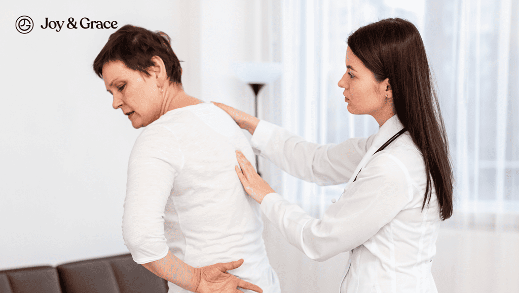 a woman getting her back examined by a woman doctor