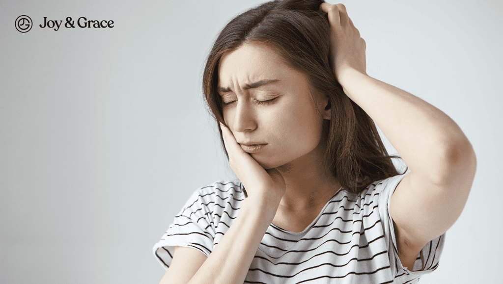 a woman with her hand on her head