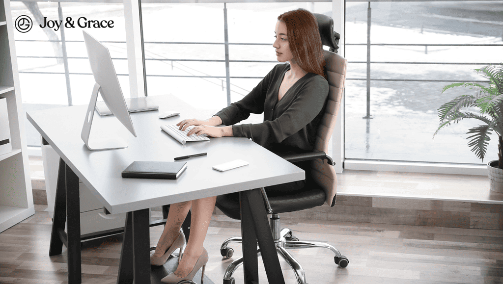 woman sitting at her desk using a computer