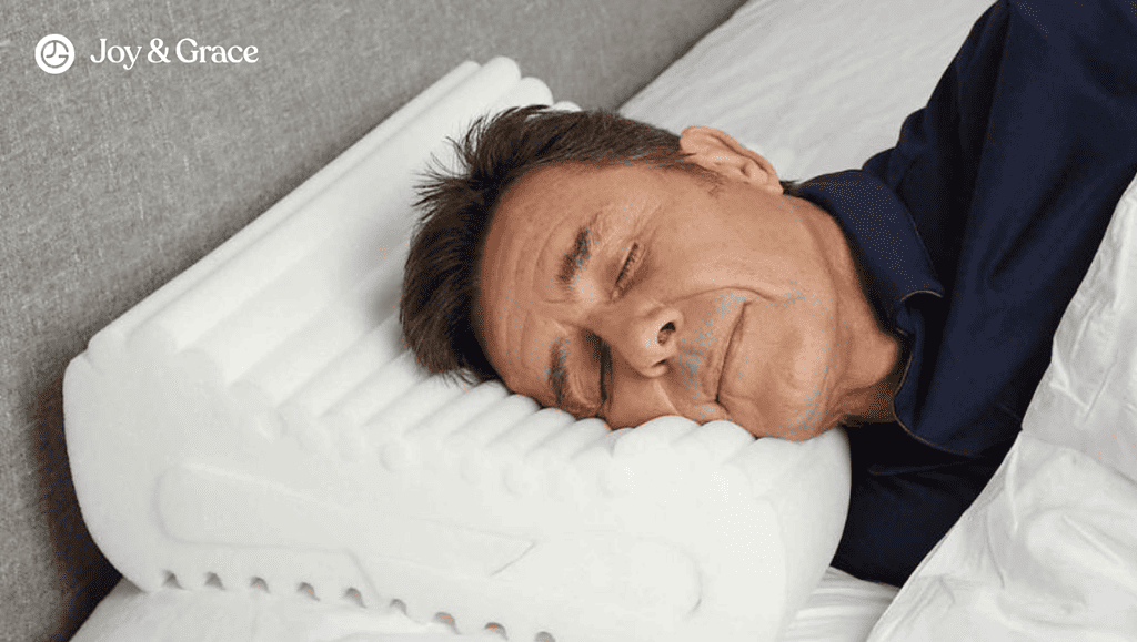 man sleeping with white air pillow on top of the bed