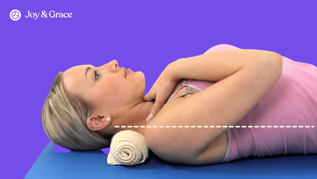 a woman lying on top of a yoga mat