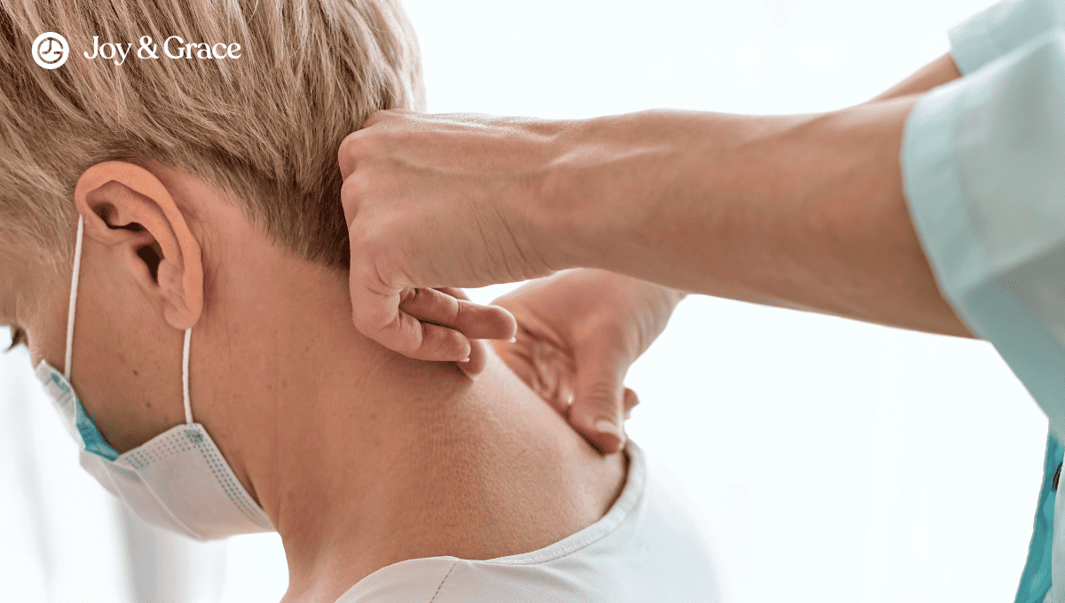 Medical provider testing a patient's neck