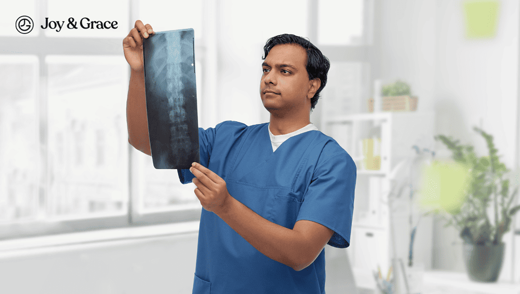 a male nurse holds up an x - ray screen