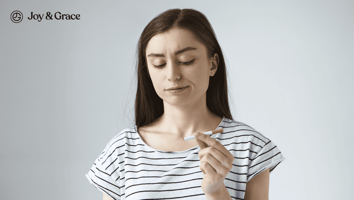 a woman holding a cigarette