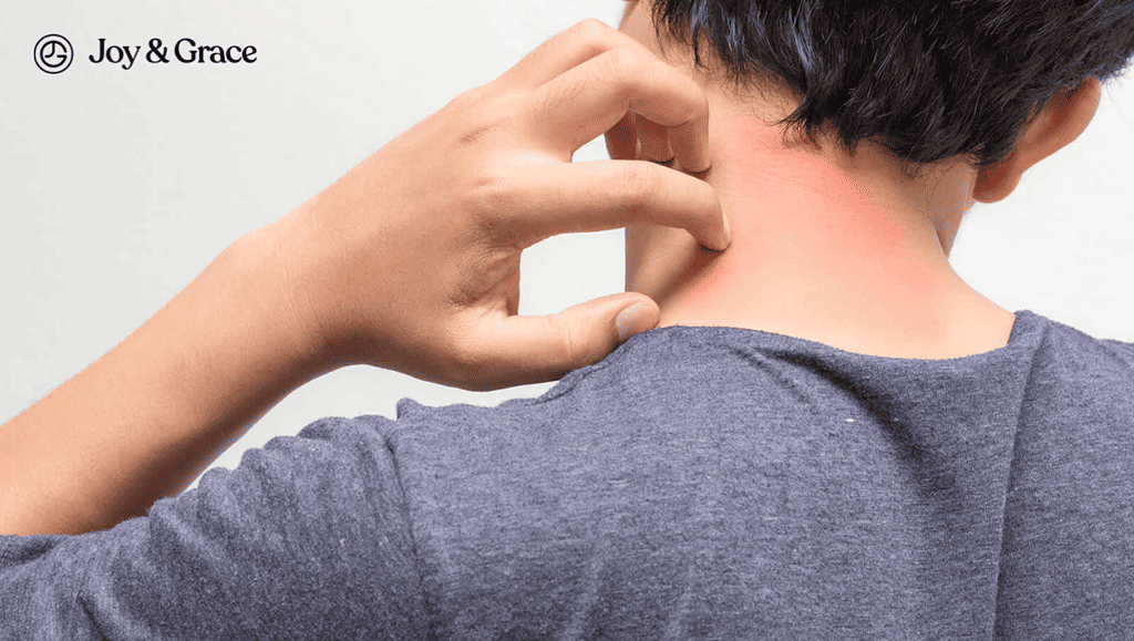 A man using his left hand to scratch the left side of the back of his neck