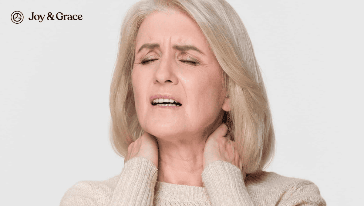 older woman with neck pain in neutral clothes