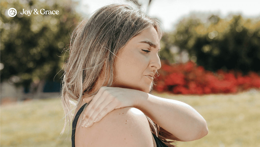 A woman evaluating her right shoulder herself