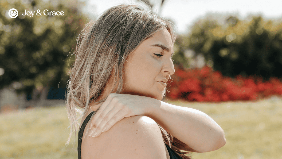 A woman evaluating her right shoulder herself