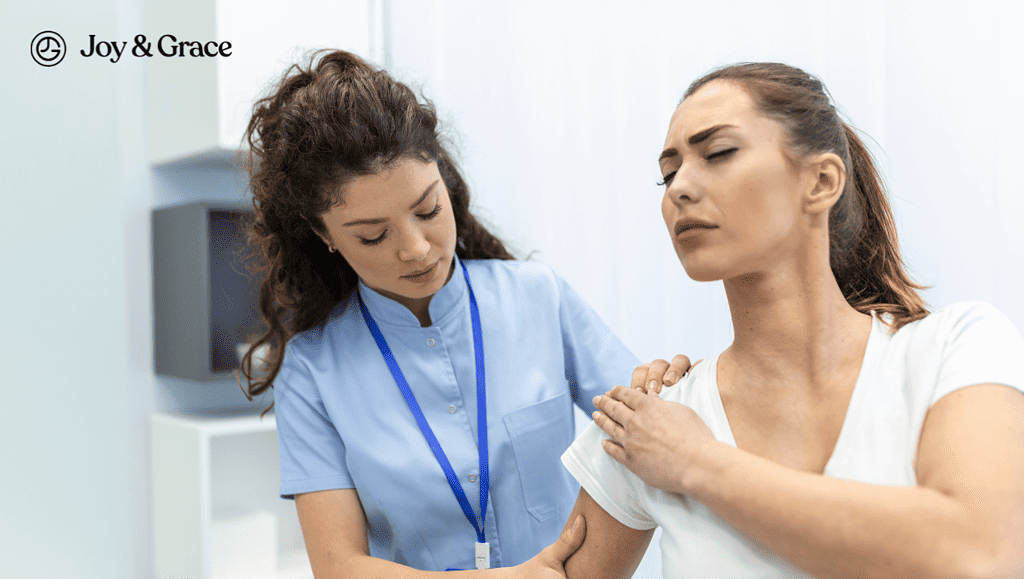 the nurse is examining the shoulder of a woman 