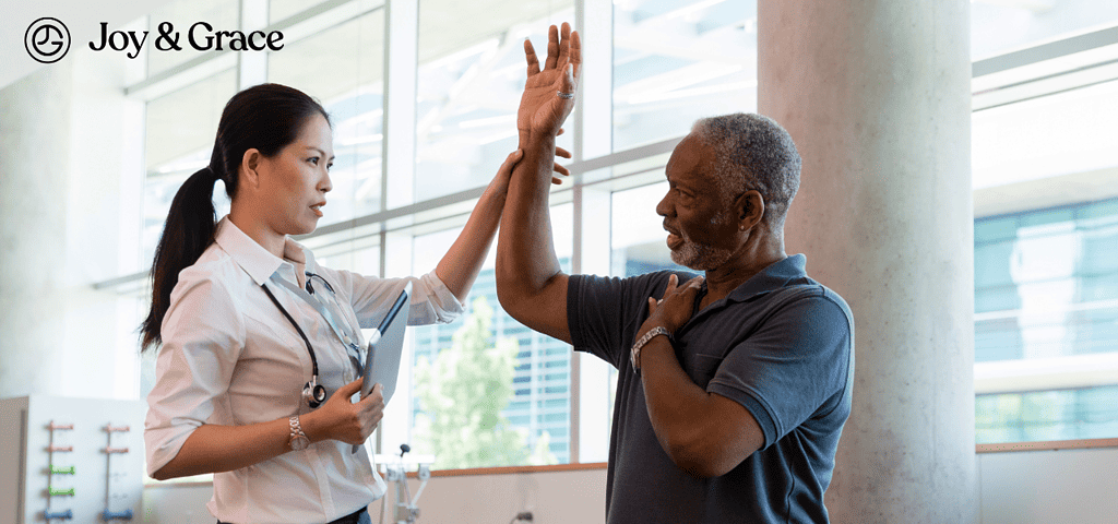 Medical provider helping a patient lift their shoulder