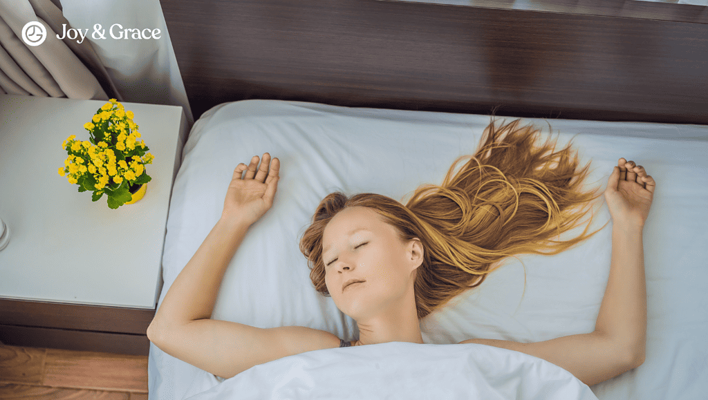 the woman is laying in bed with her hair up