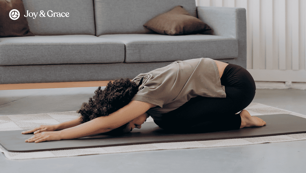 a woman stretching out on her yoga mat