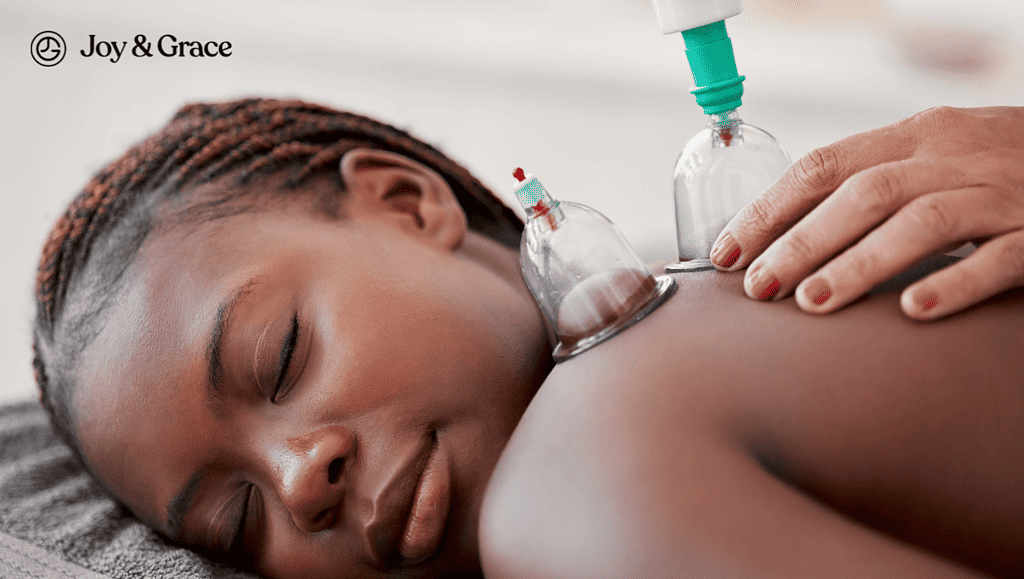 A woman experiencing relief through cupping therapy.