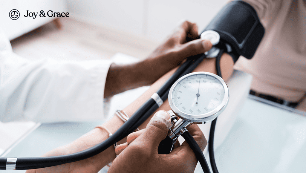 A doctor is examining a patient's blood pressure and evaluating the possibility of heart-related pain in their left shoulder.