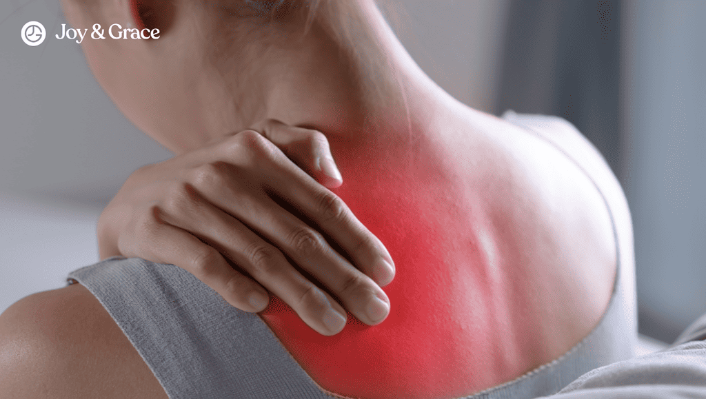 A woman experiencing myofascial pain in her neck and shoulder.