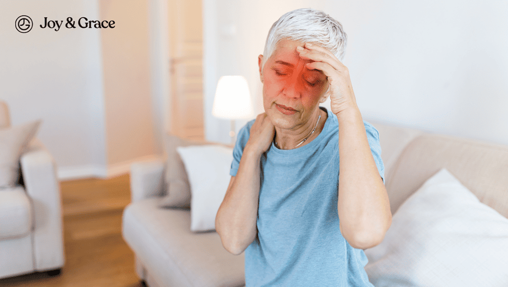 A woman is sitting on a couch with sinus pain.