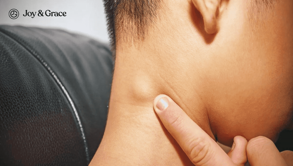 A man is experiencing neck discomfort.