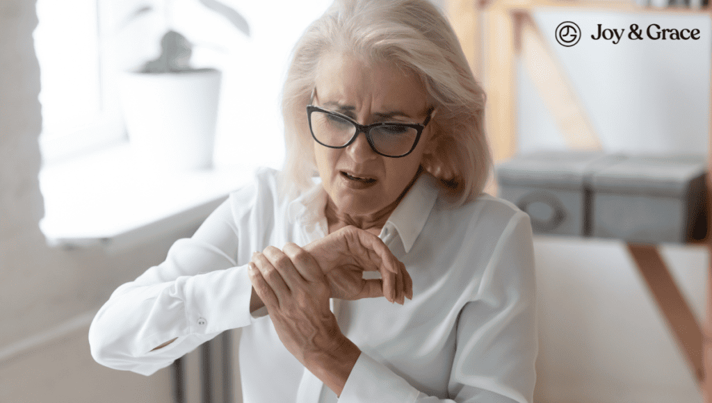 A woman in glasses is putting pressure on her wrist, possibly indicating discomfort or pain related to Carpal Tunnel Syndrome.