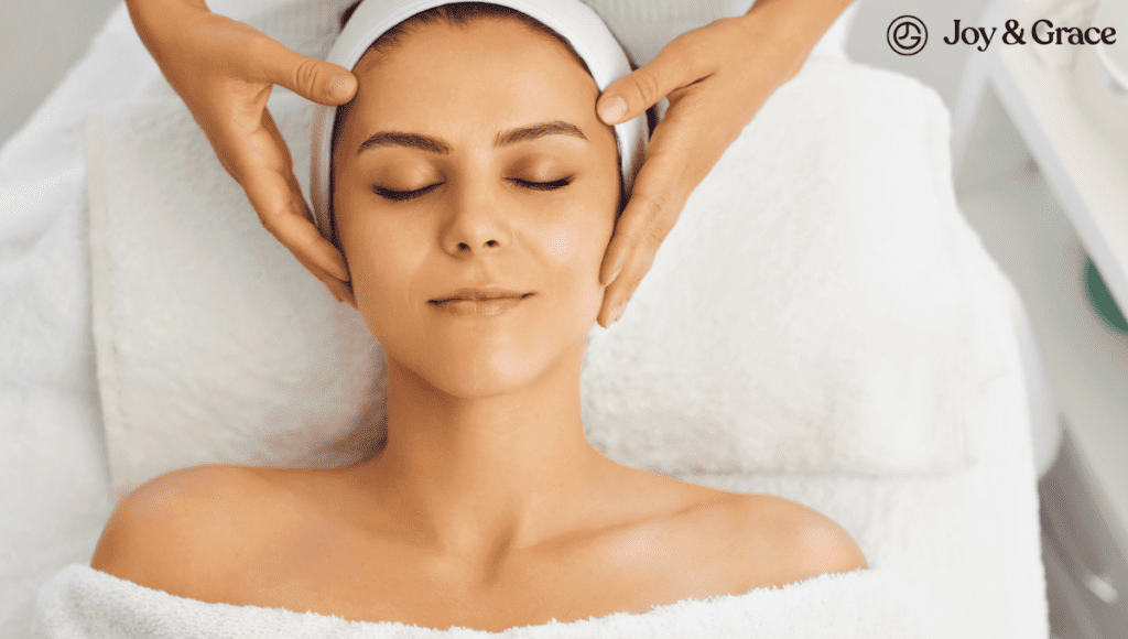 A woman receiving a facial massage at a spa for relaxation.