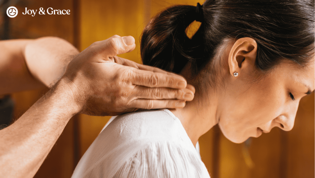 A woman is receiving a massage to relieve neck pain.