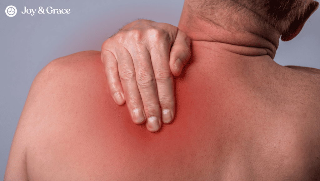 A man experiencing stabbing pain in the back of his left shoulder blade.