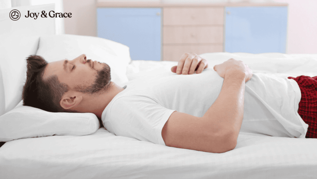 A man laying in bed with his hands on his chest, experiencing neck pain.