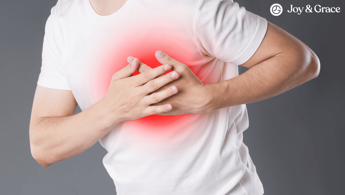 A man is holding his chest with shoulder pain.