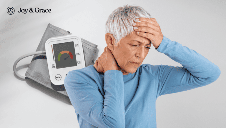 A woman is holding a blood pressure monitor, concerned about her high blood pressure.