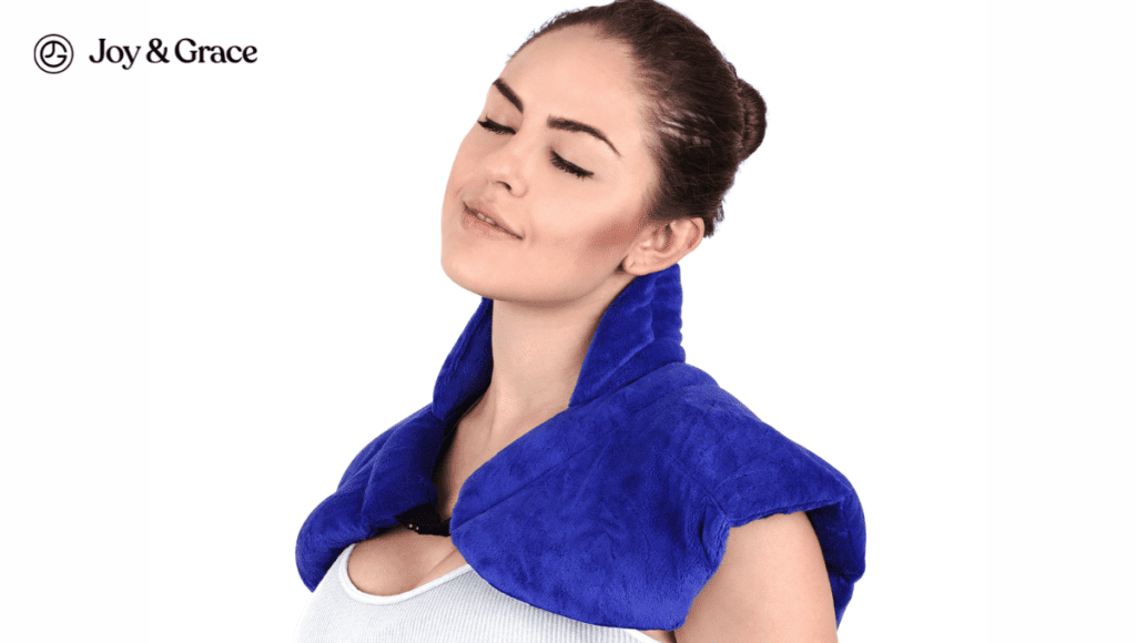 A woman wearing a blue neck wrap finds relief for her neck pain at home using remedies.