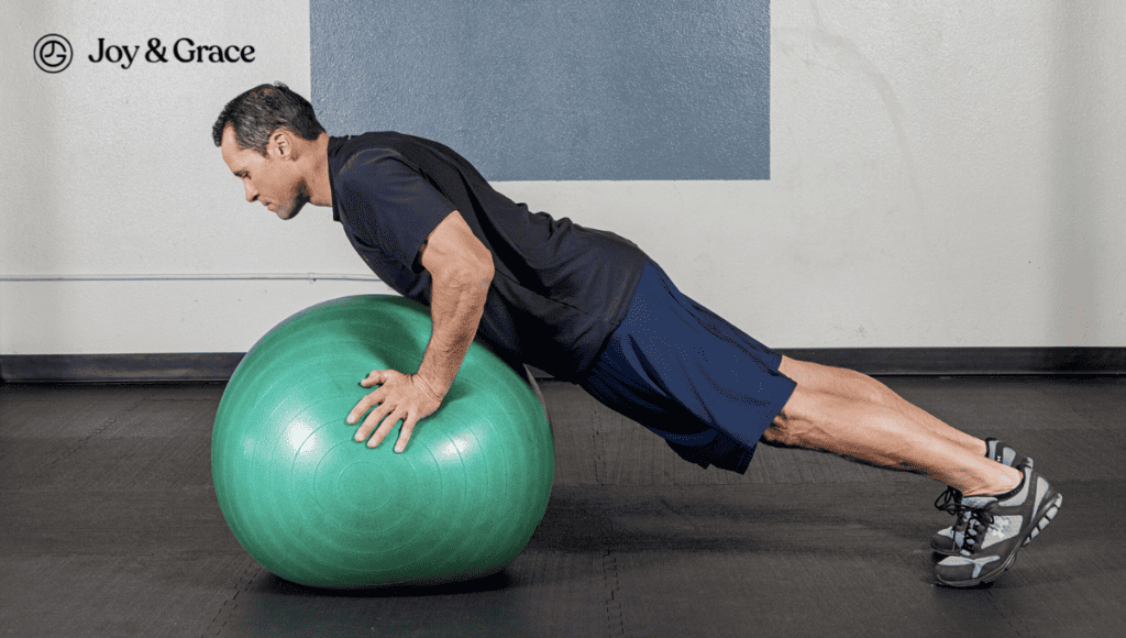 A man demonstrating proper push-up technique on an exercise ball, minimizing the risk of shoulder pain.