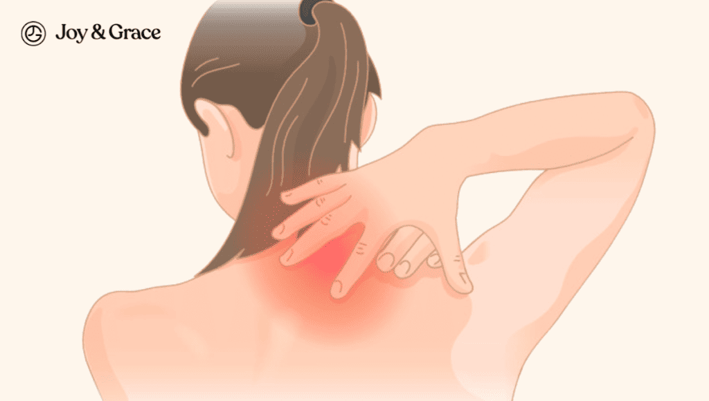 A woman experiencing sharp and stabbing pains in her shoulder blade.