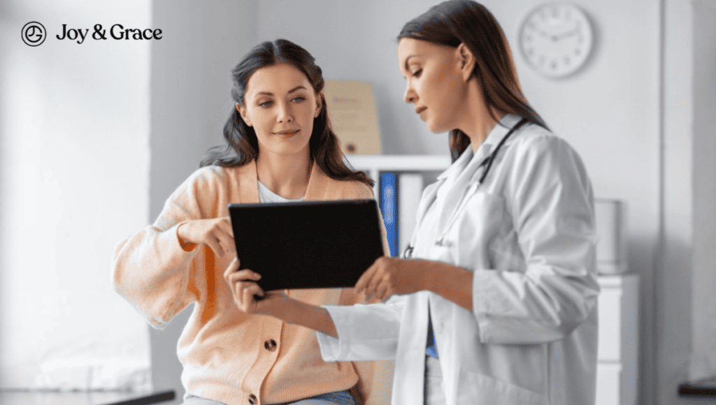 A woman showing a tablet to a doctor for sinus infections and neck pain.